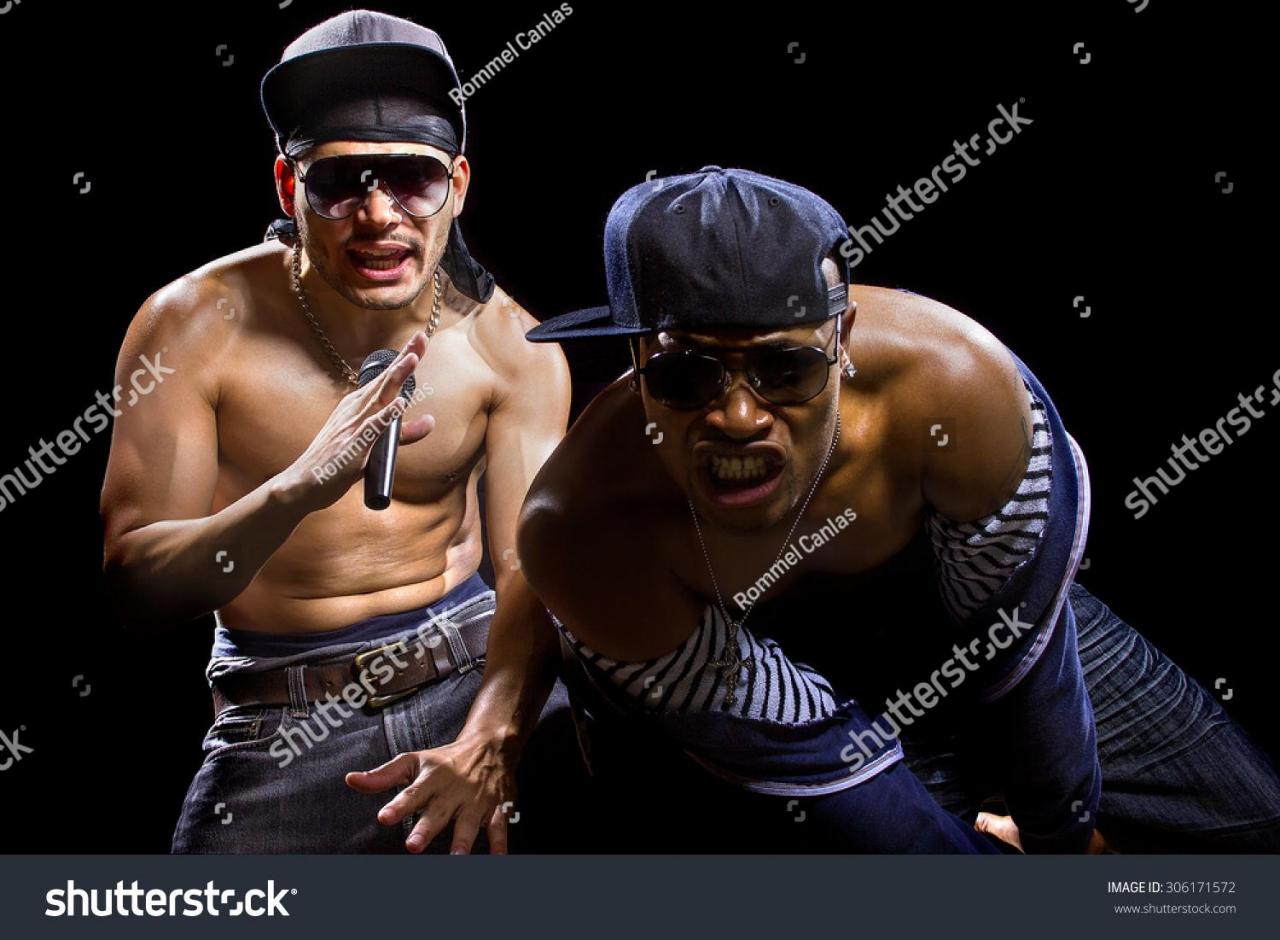 stock-photo-rap-concert-with-two-muscular-shirtless-men-with-microphones-the-musicians-are-hip-hop-artists-306171572.jpg